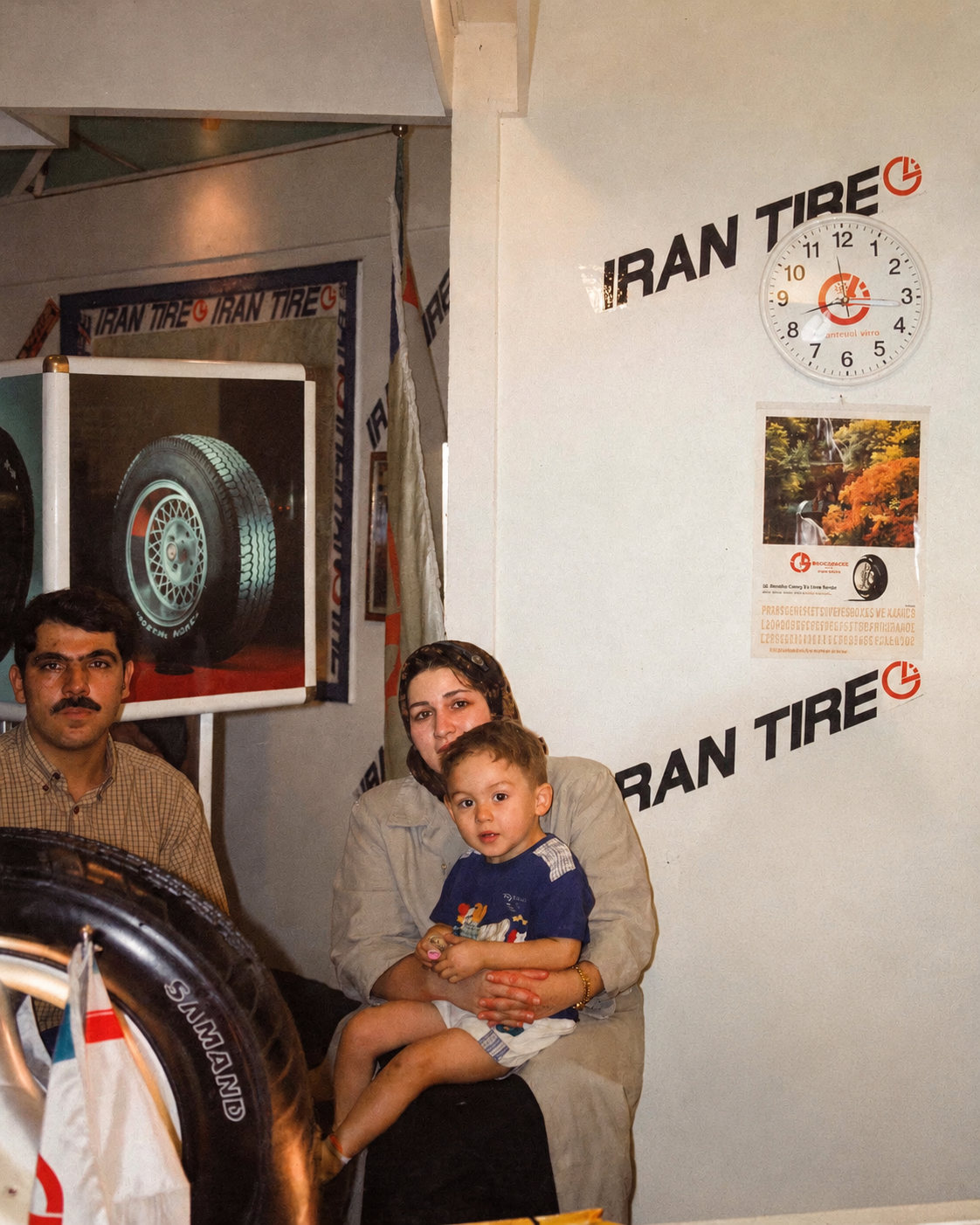 A proud moment in our family legacy: Mansour Malakouti with his son, Sahand, at an Iran Tire shop in 1999, celebrating deep-rooted community service and safety