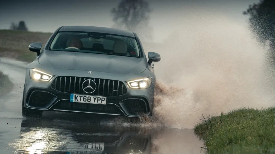 Premium Mercedes-Benz on a wet road, demonstrating reliable tire traction and performance