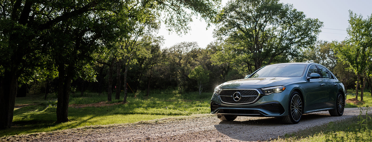 A premium Mercedes-Benz vehicle on a country road, showcasing the smooth and reliable performance provided by tires from Roadstar Tire in Richmond Hill