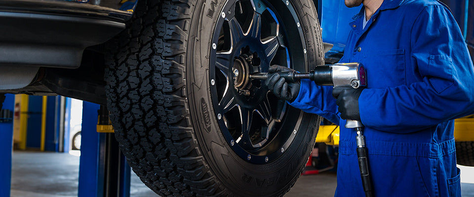 Certified technician performing professional tire installation and balancing at Roadstar Tire in Richmond Hill